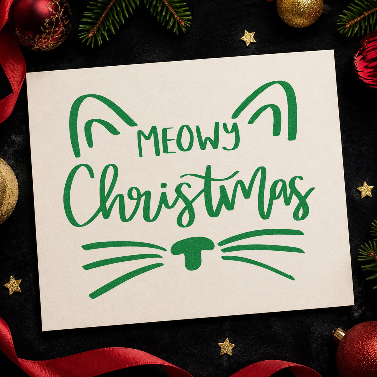 Meowy Christmas Cat Face craft stamp imprint in green ink on a handmade project, one idea being cat cafe cards.