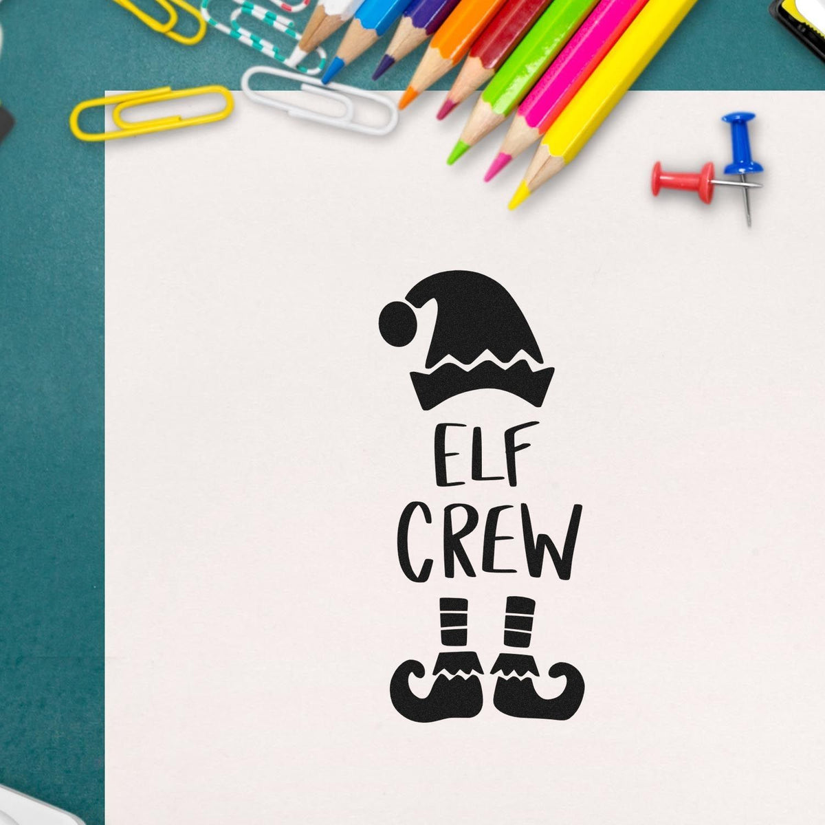 Premium Wooden Elf Crew Hat And Shoes Lettering Stamp - Vintage Pro imprint stamped in black ink. The words "Elf crew" appear between a pointed elf hat and striped legs with curled shoes.
