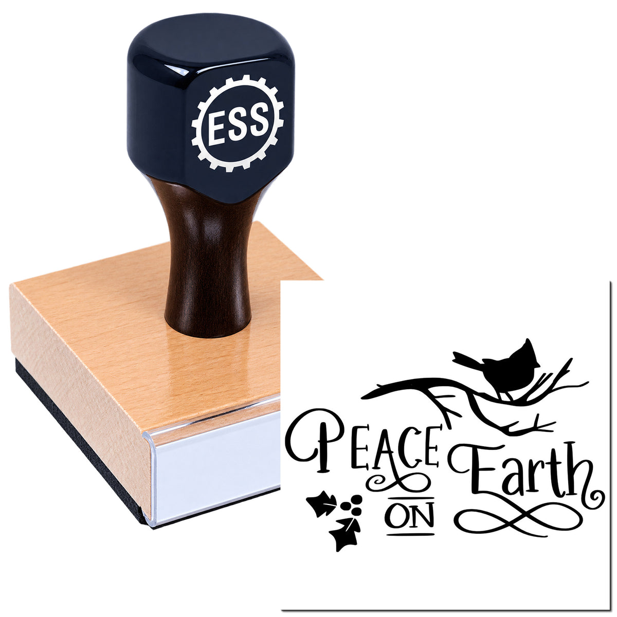 Dark navy ESS rubber stamp on a wooden block beside a black Peace on Earth seal with bird and branch.