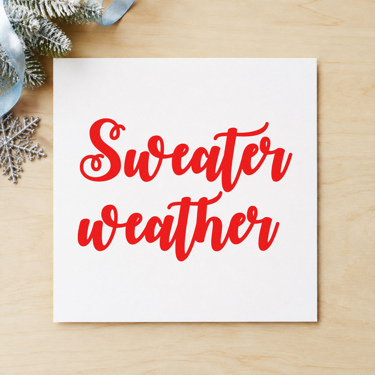 Sweater Weather Brush Script craft stamp in red ink on cardstock, an easy option for sweatshirt front ink.