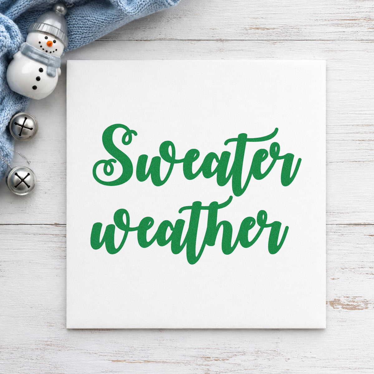 Sweater Weather Brush Script craft stamp imprinted in green ink on paper, a design suited to framed bold print.
