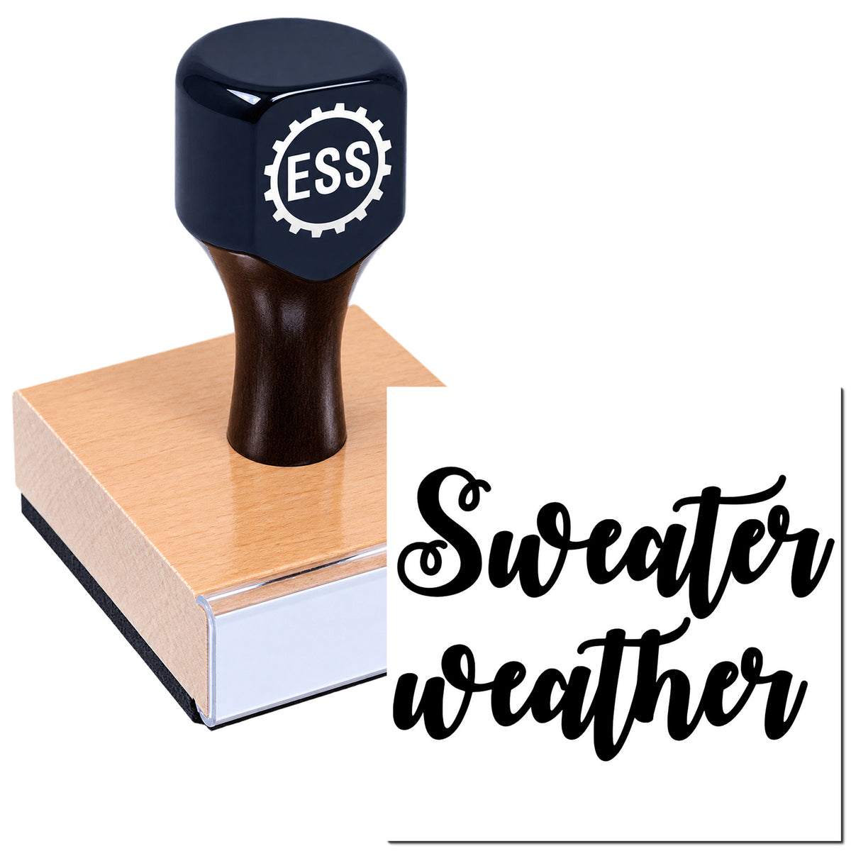 Black ESS rubber stamp on a wooden seal block, with "Sweater weather" in bold black script on white.