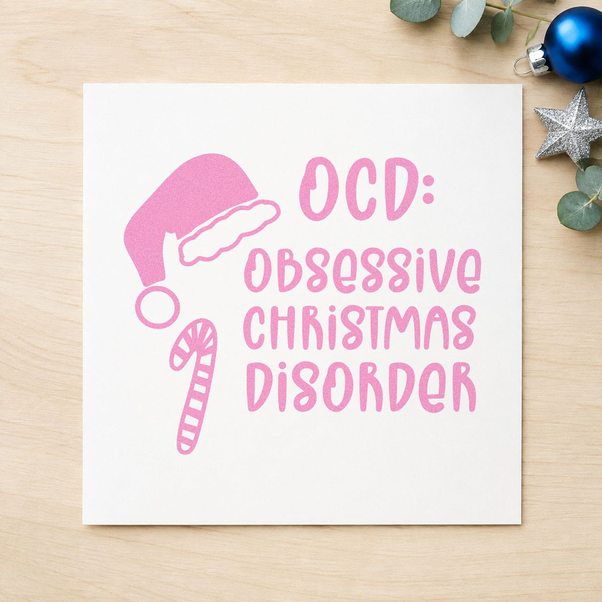 Obsessive Christmas Disorder Hat craft stamp in purple ink on cardstock, an easy option for shop haul album.