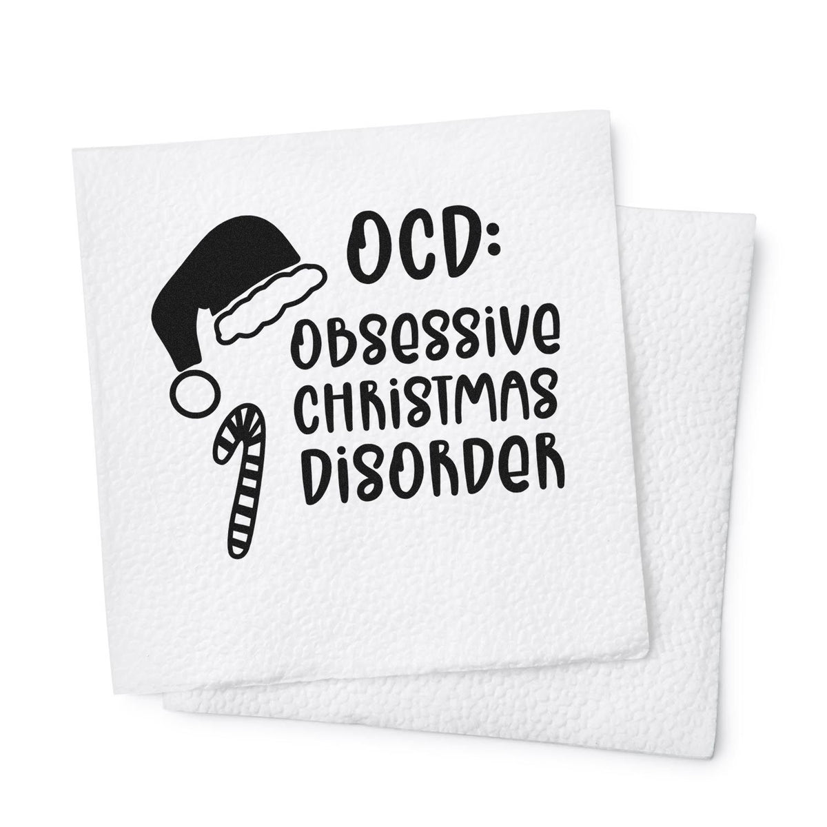 Black Christmas stamp and seal on white textured paper featuring Santa hat, candy cane, and OCD: Obsessive Christmas Disorder.