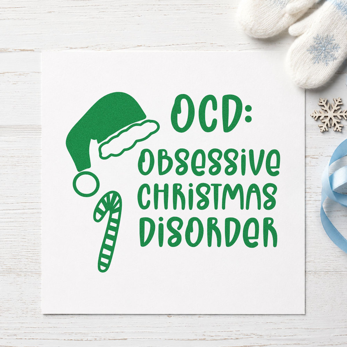 Obsessive Christmas Disorder Hat craft stamp imprint in green ink on a handmade project, one idea being purchase gift tags.