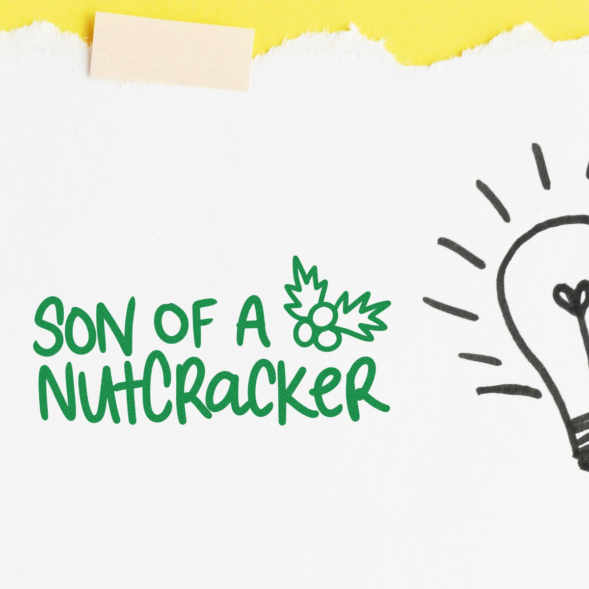 Green holiday stamp and seal reading Son of a Nutcracker with holly, on white paper with a black lightbulb doodle.