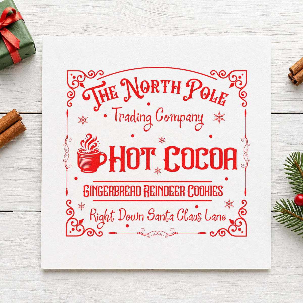 North Pole Trading Hot Cocoa rubber stamp shown in red ink, stamped for projects such as topping cup labels.