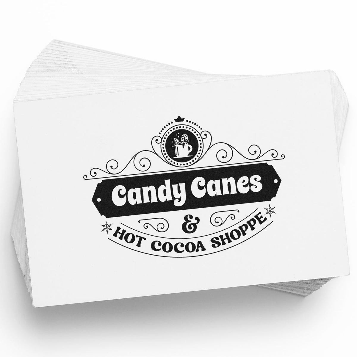 Stack of white custom stamp and seal cards with black vintage Candy Canes & Hot Cocoa Shoppe logo and cocoa mug icon.
