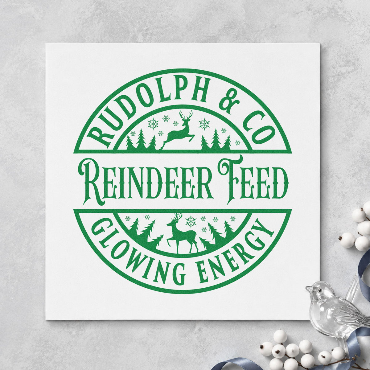 Rudolph Reindeer Feed Badge craft stamp imprinted in green ink on paper, a design suited to framed barn room.