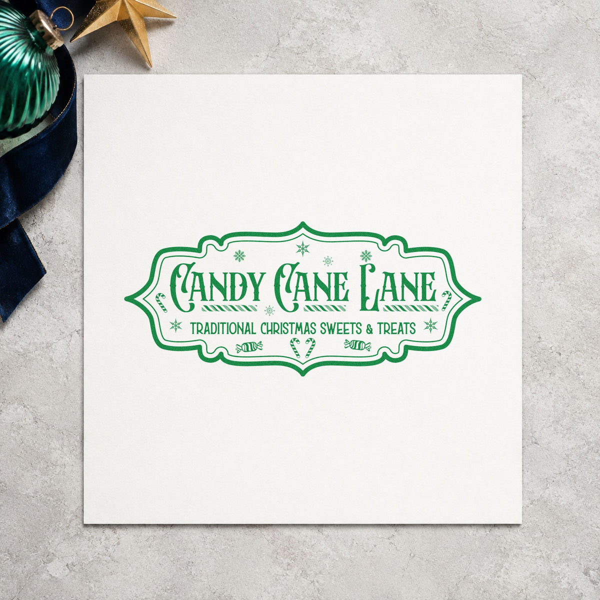 Candy Cane Lane Vintage Sign craft stamp imprint in green ink on a handmade project, one idea being street party cards.