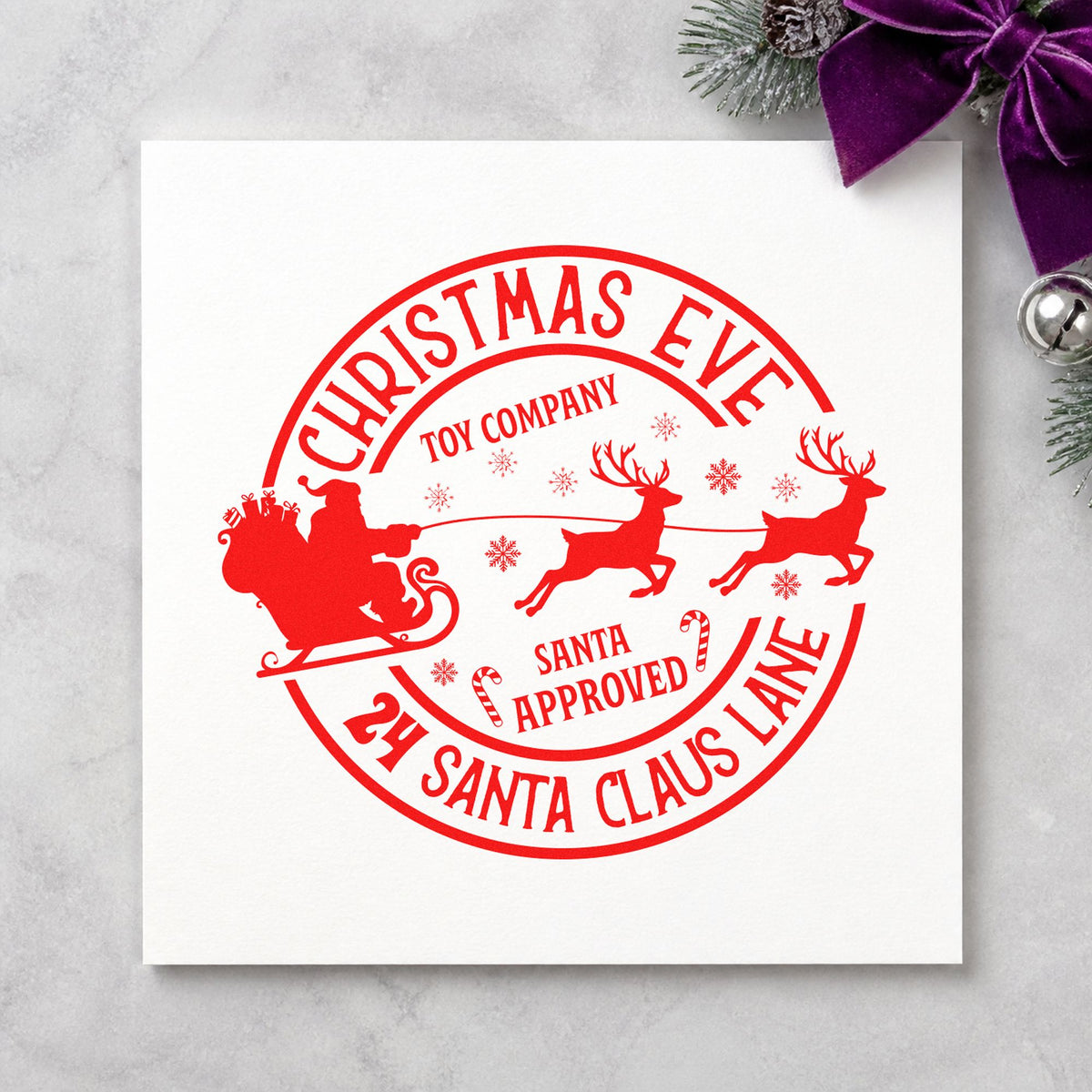 Christmas Eve Toy Company craft stamp in red ink on cardstock, an easy option for bench cloth printing.