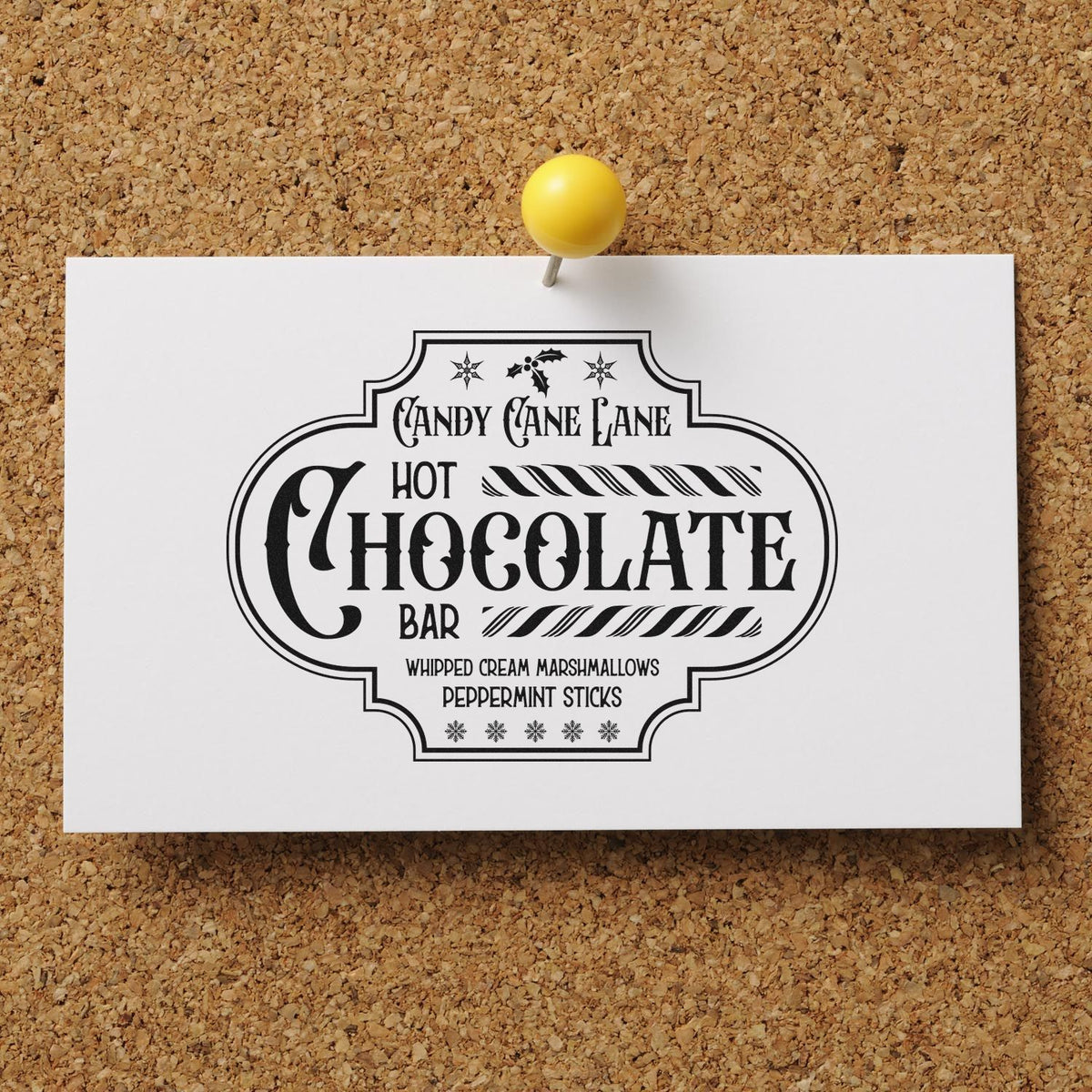 Black Candy Cane Lane hot chocolate stamp and seal design on white card, pinned to cork board with yellow pushpin.