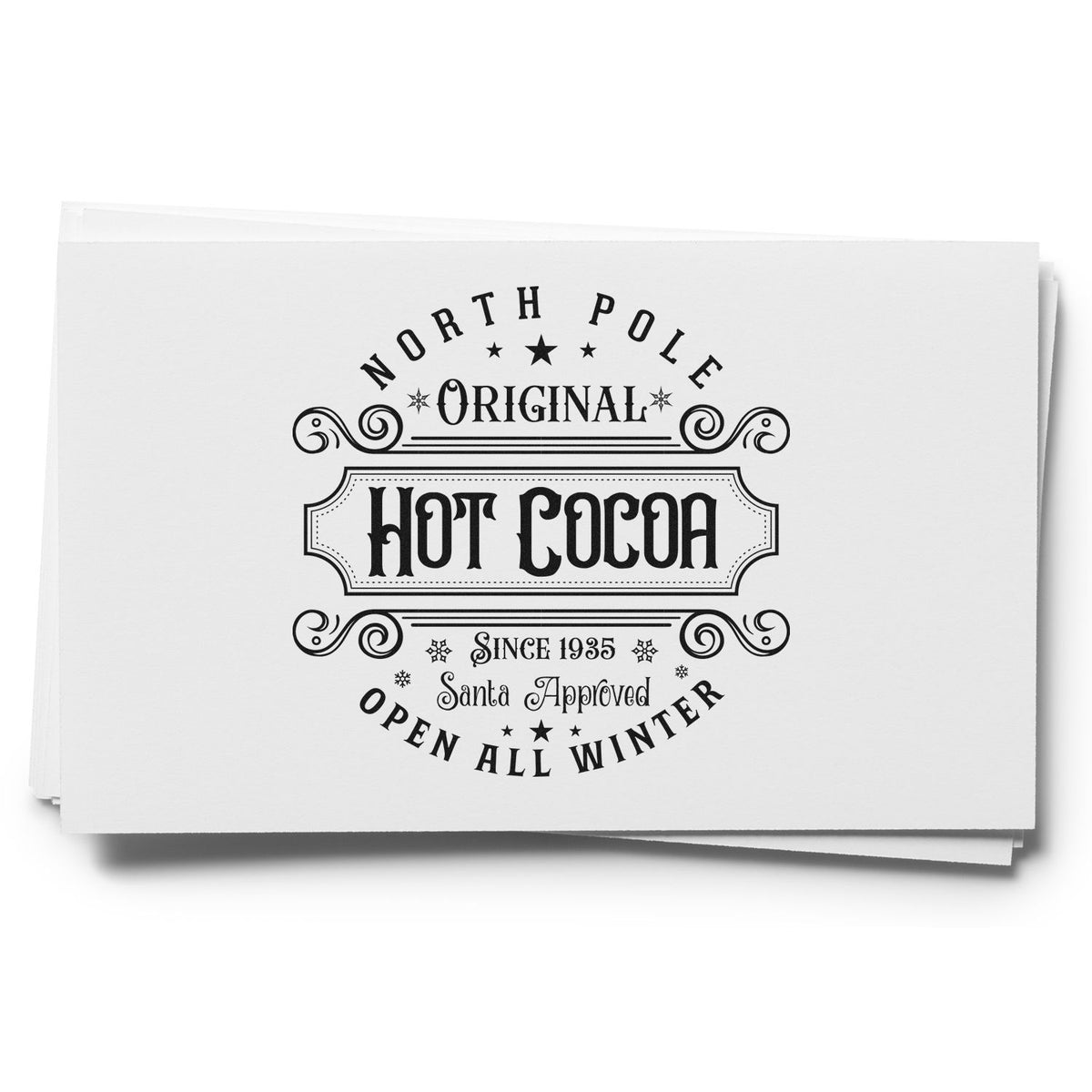 Stack of white stamp-and-seal cards with black vintage North Pole Original Hot Cocoa design, Santa approved, open all winter.