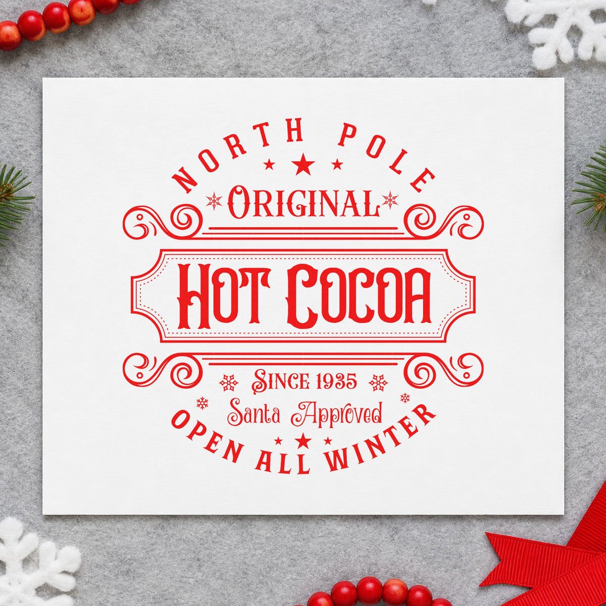 North Pole Original Hot Cocoa rubber stamp shown in red ink, stamped for projects such as storage tin labels.