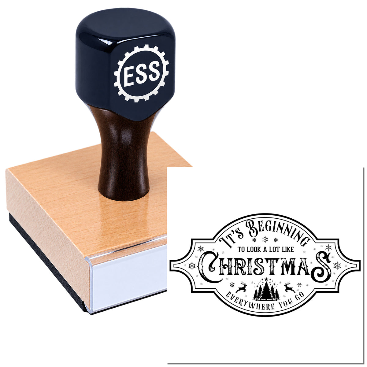 Dark navy custom rubber stamp with wooden handle on a pink block, plus a black Christmas seal label.