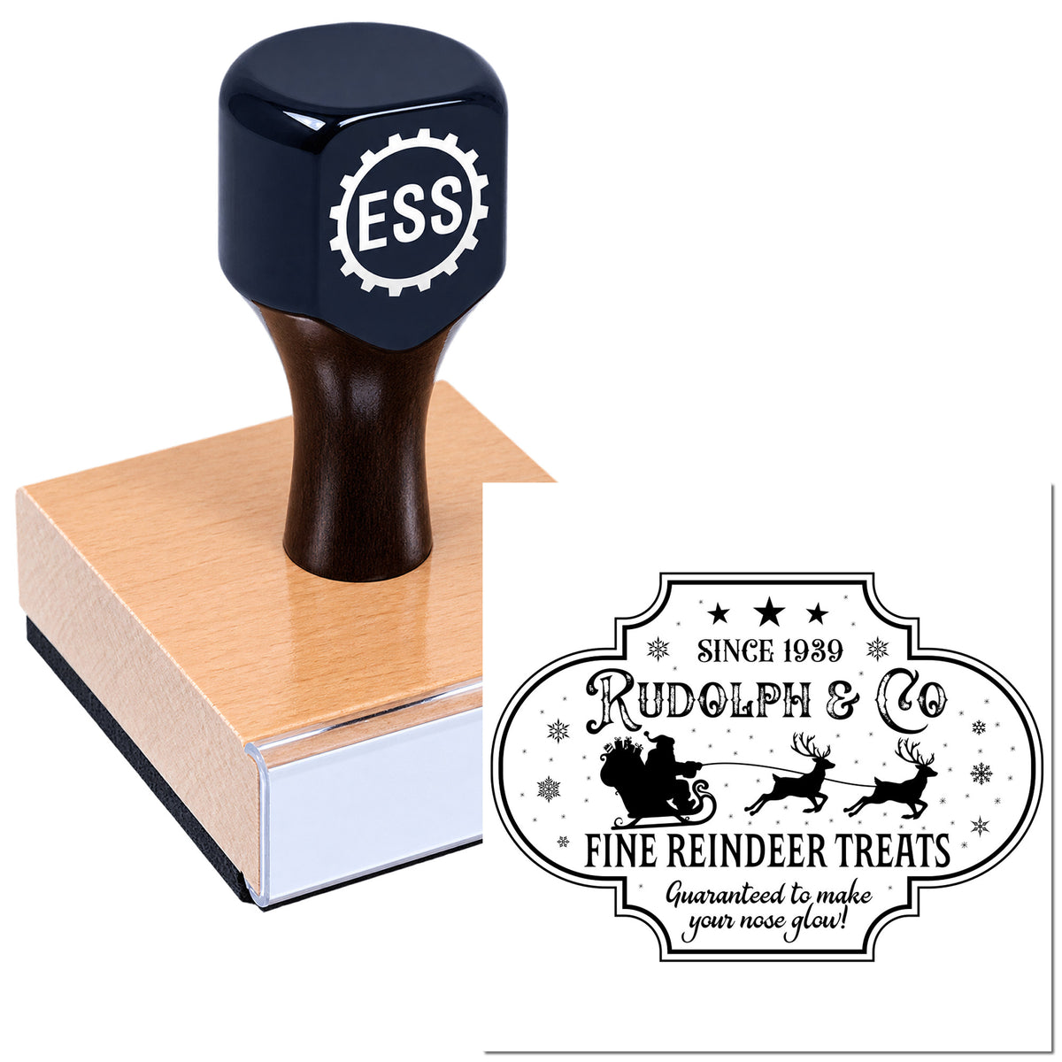 Black custom rubber stamp with ESS logo on a wooden block beside a white holiday seal reading Rudolph & Co Fine Reindeer Treats