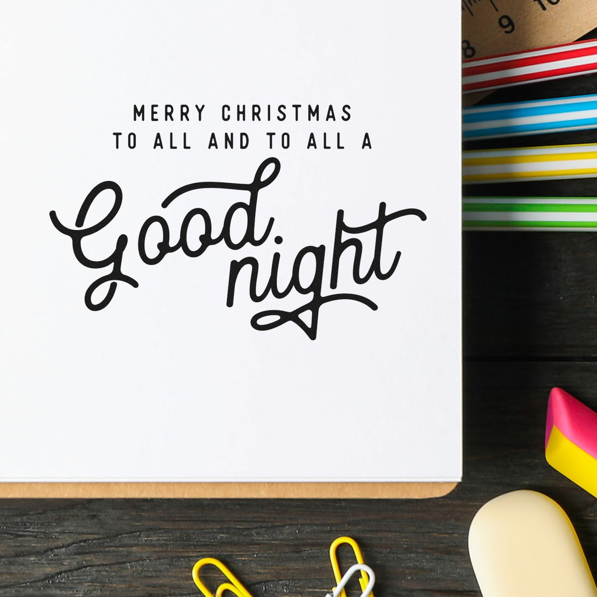 White card with black Good night lettering and Merry Christmas text beside colorful striped stamp and seal products.