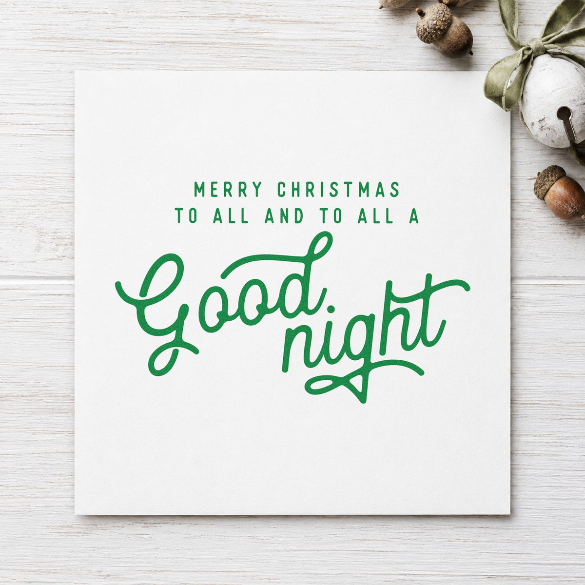 Merry Christmas Good Night craft stamp imprint in green ink on a handmade project, one idea being story night cards.