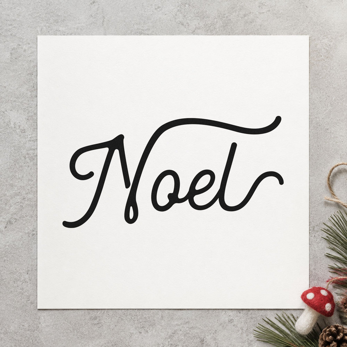 Noel Flowing Script rubber stamp printed in black ink, ready for letterhead rule sheet and similar paper crafts.