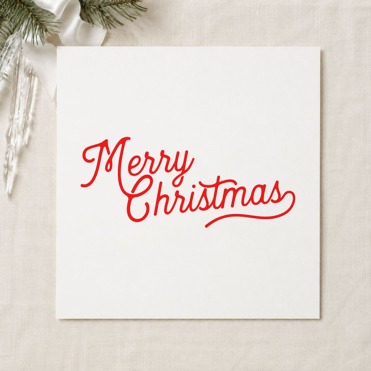 Merry Christmas Script Greeting craft stamp in red ink on cardstock, an easy option for sleeve line printing.
