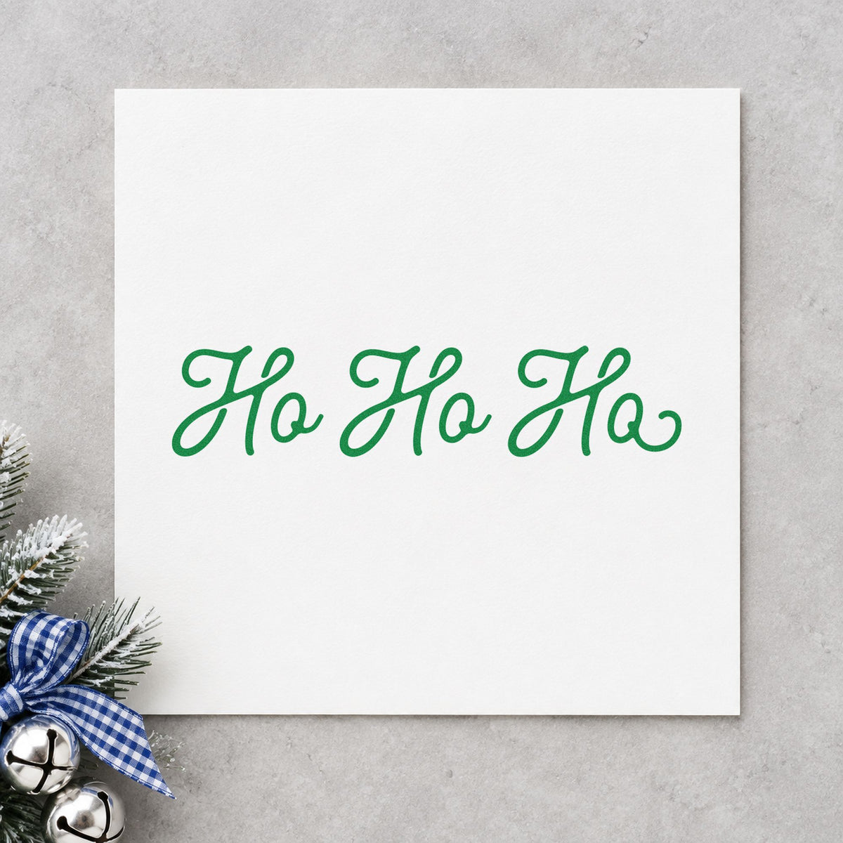 Ho Ho Ho Script craft stamp imprint in green ink on a handmade project, one idea being menu rule slips.