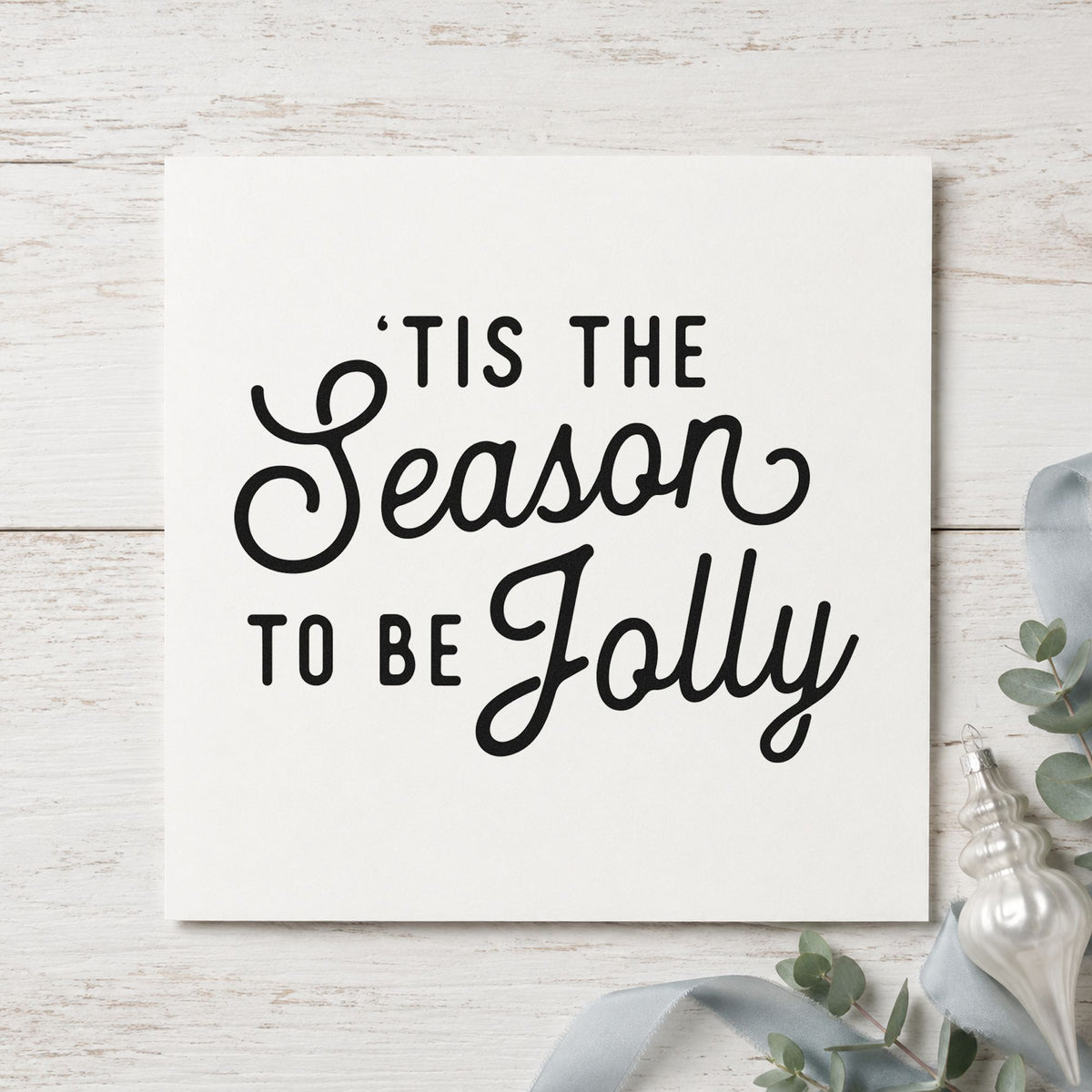 Tis The Season Jolly Script craft stamp imprint in black ink on a handmade project, one idea being everyday gift tags.