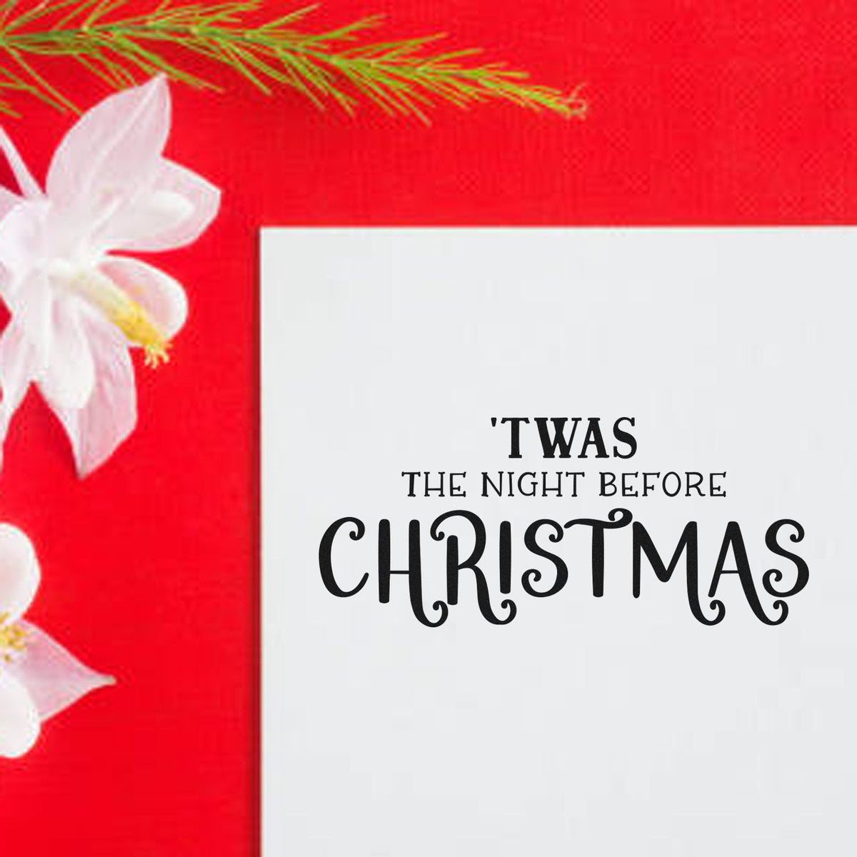 White Christmas stamp and seal design with black 'Twas the Night Before Christmas text on a red background and white flowers.