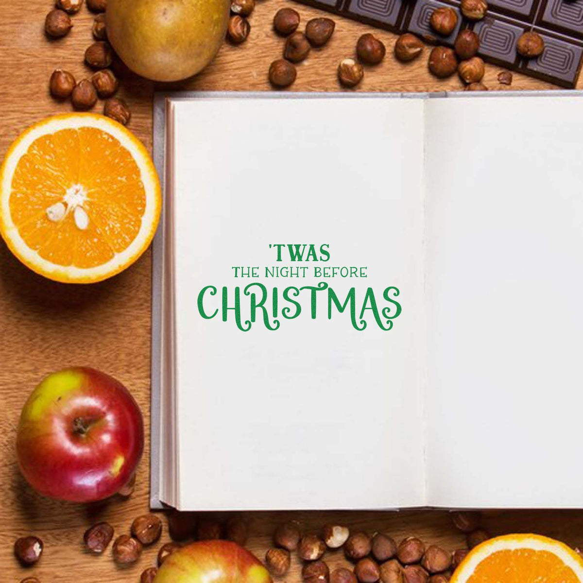 Green Twas the Night Before Christmas stamp on open white page, with oranges, apples, nuts, and embossed seal blocks.