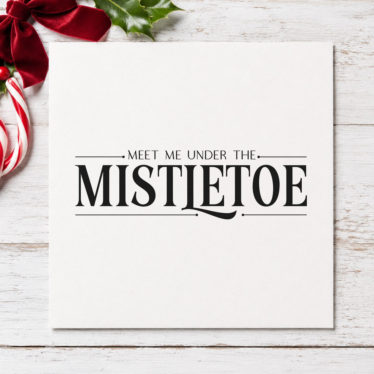 Meet Me Under The Mistletoe rubber stamp printed in black ink, ready for between rules cards and similar paper crafts.