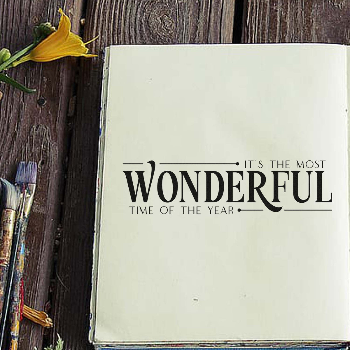 Cream stamp and seal with black "Wonderful Time of the Year" lettering on rustic wood, accented by yellow flowers.