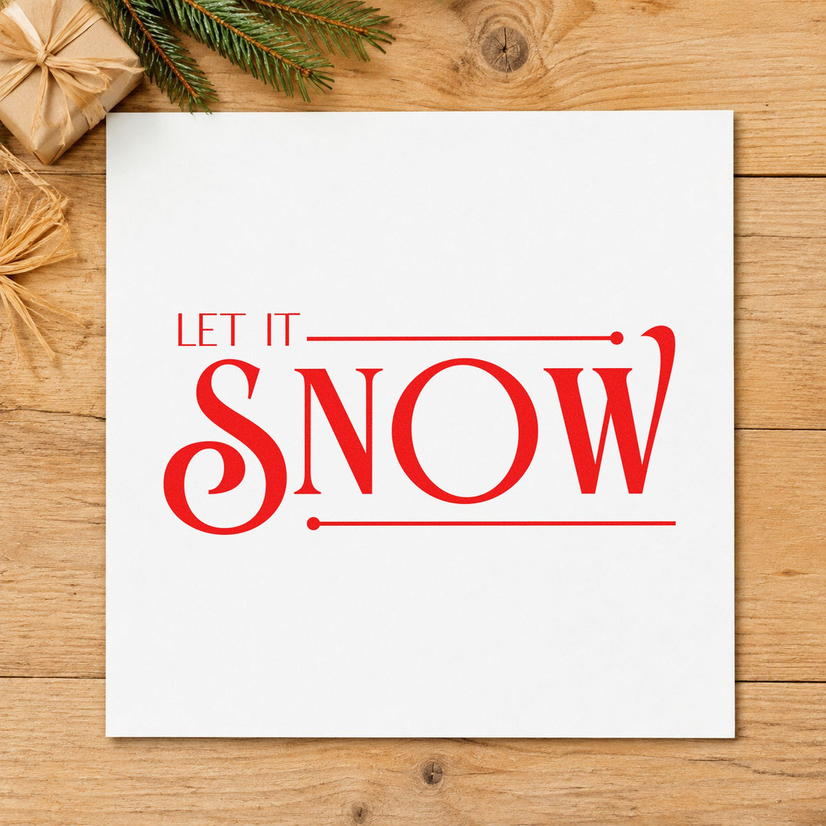 Let It Snow Serif craft stamp in red ink on cardstock, an easy option for garment bag printing.