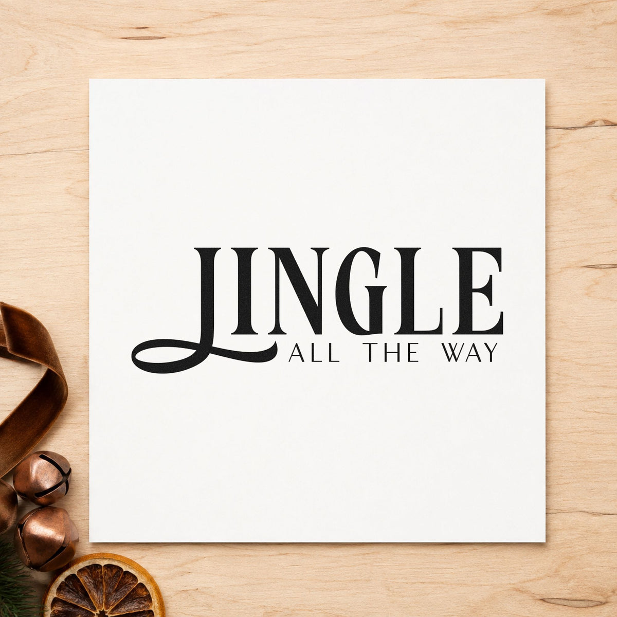 Jingle All The Way Serif craft stamp imprint in black ink on a handmade project, one idea being swept tail gift tags.