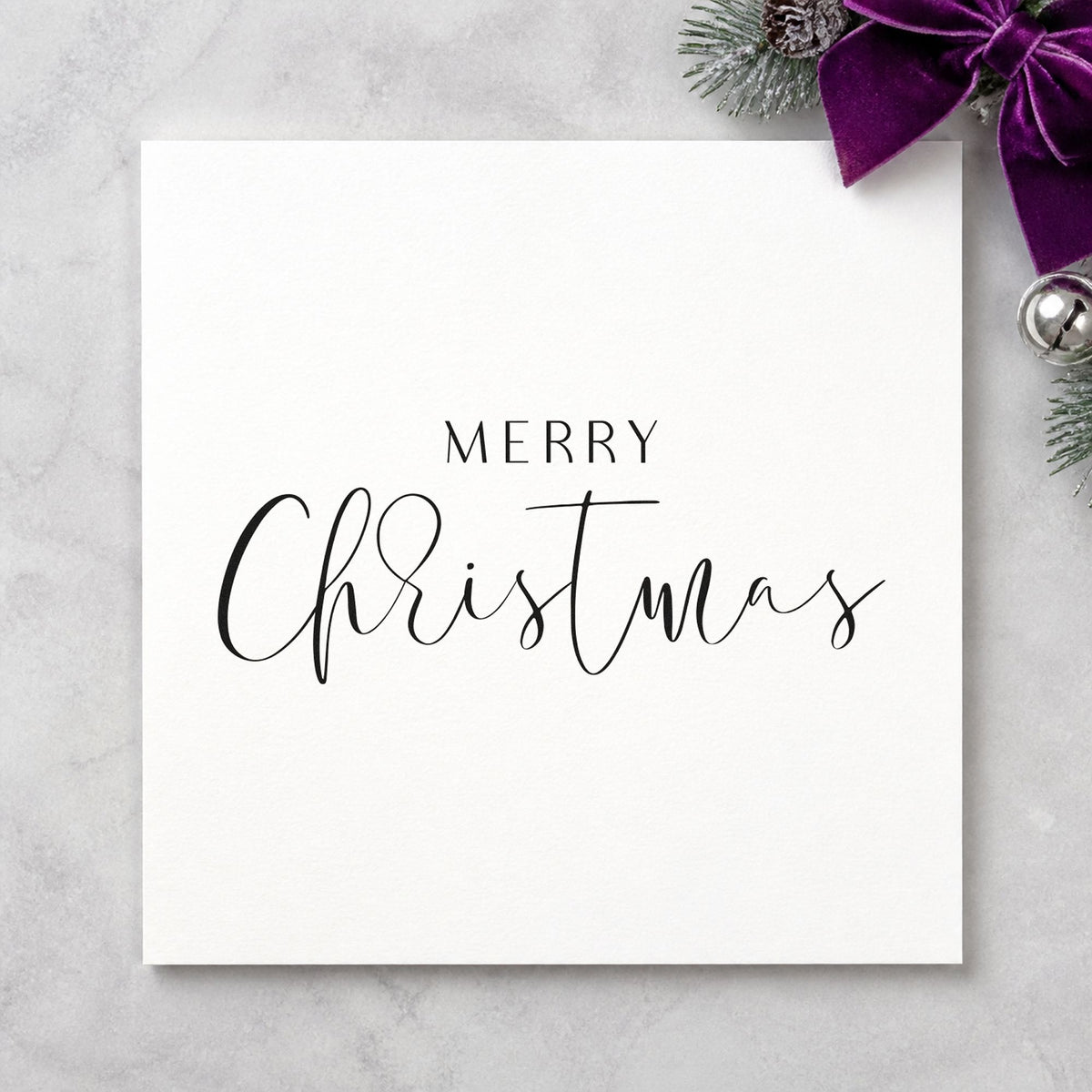Merry Christmas Fine Script craft stamp imprint in black ink on a handmade project, one idea being satin ribbon tags.