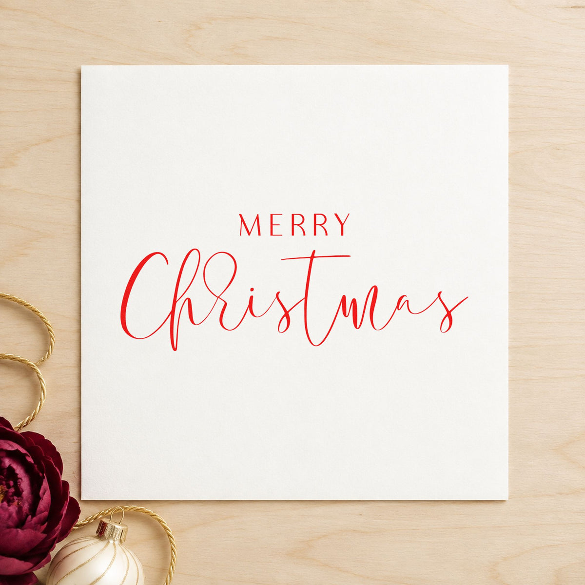 Merry Christmas Fine Script craft stamp in red ink on cardstock, an easy option for veil hem printing.