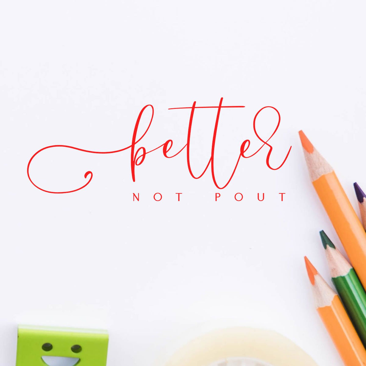 Red better not pout stamp and seal design on white paper, with orange, green, and purple pencils.