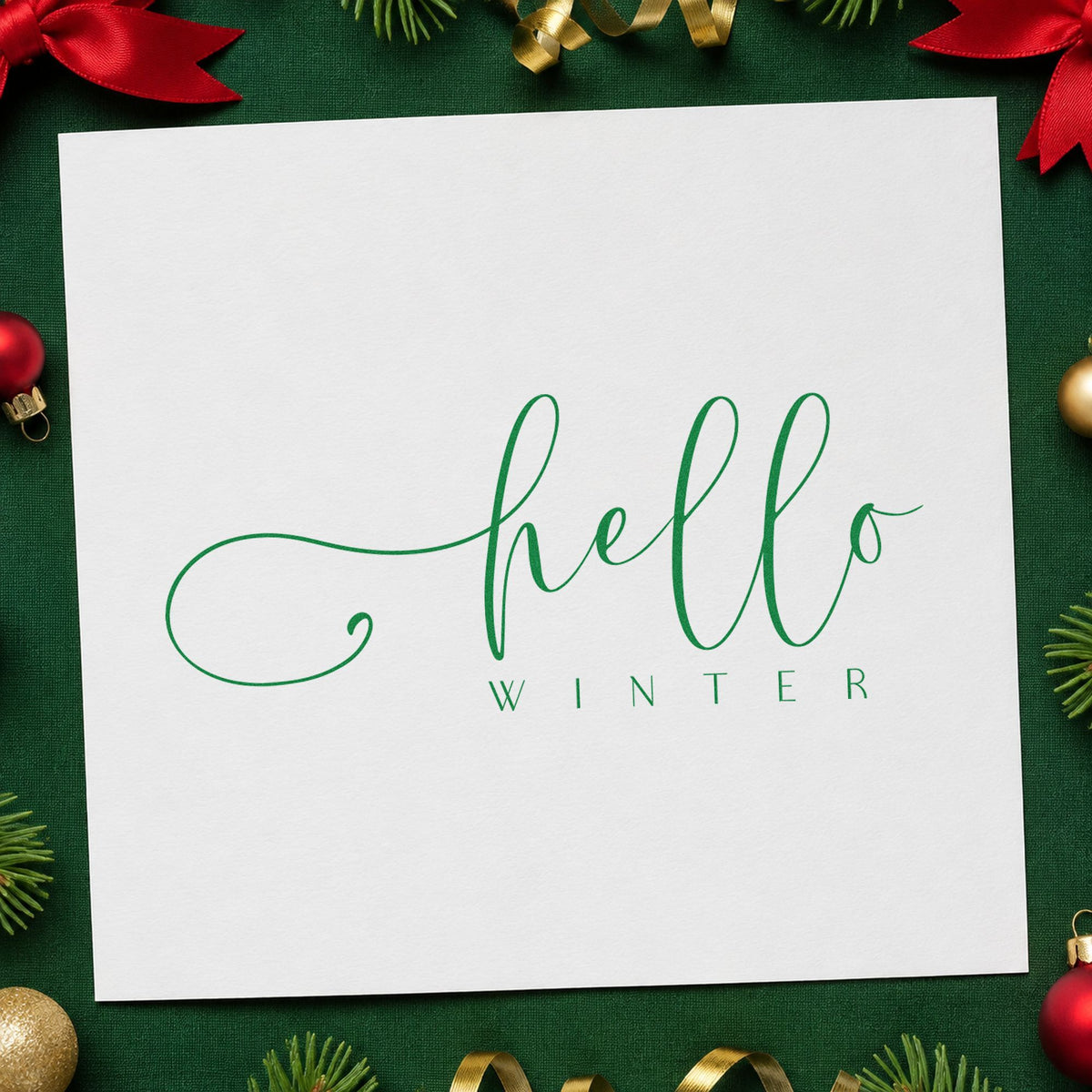 Hello Winter Fine Script craft stamp imprinted in green ink on paper, a design suited to framed studio shelf.