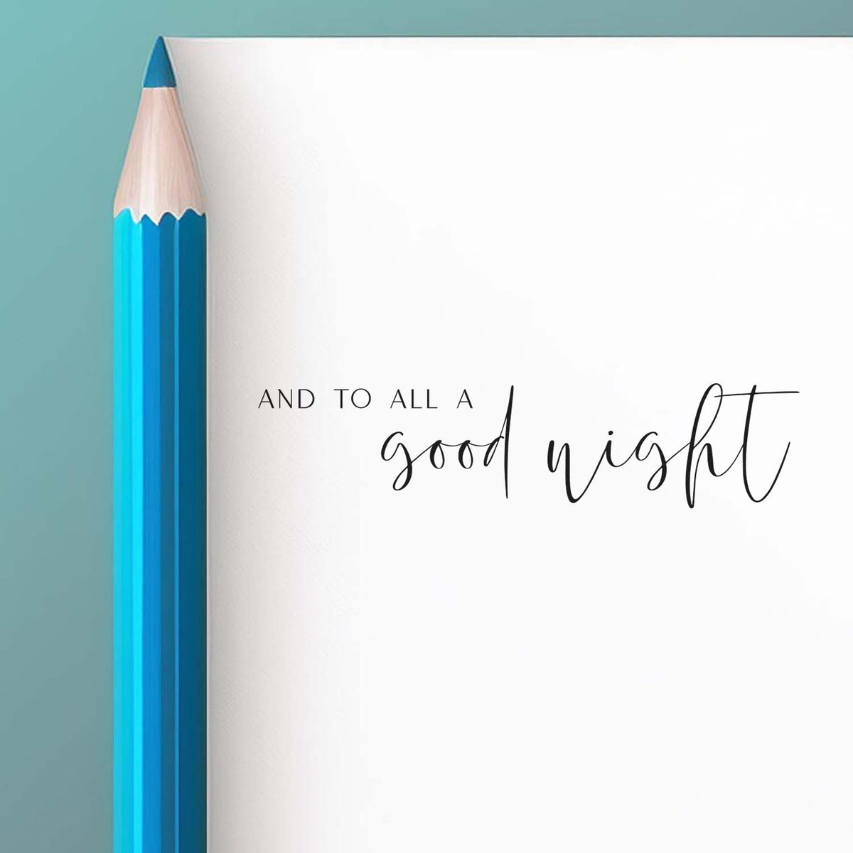 Blue pencil beside white holiday stamp-and-seal card with And to all a good night on teal background.