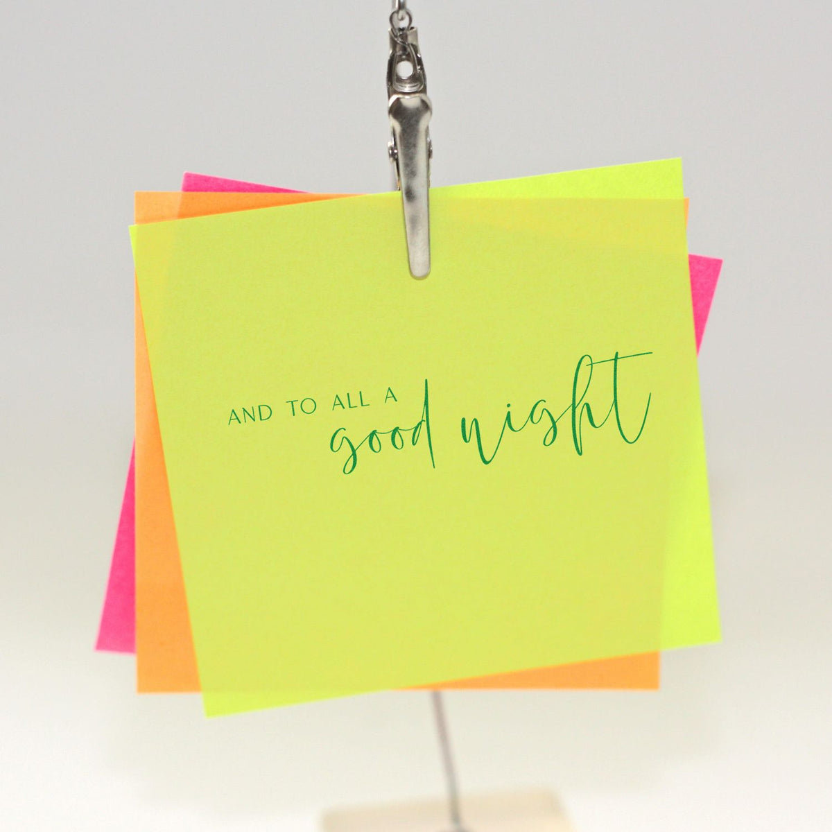 Neon yellow, orange and pink sticky note stamp and seal card clipped with silver clip, reading and to all a good night.