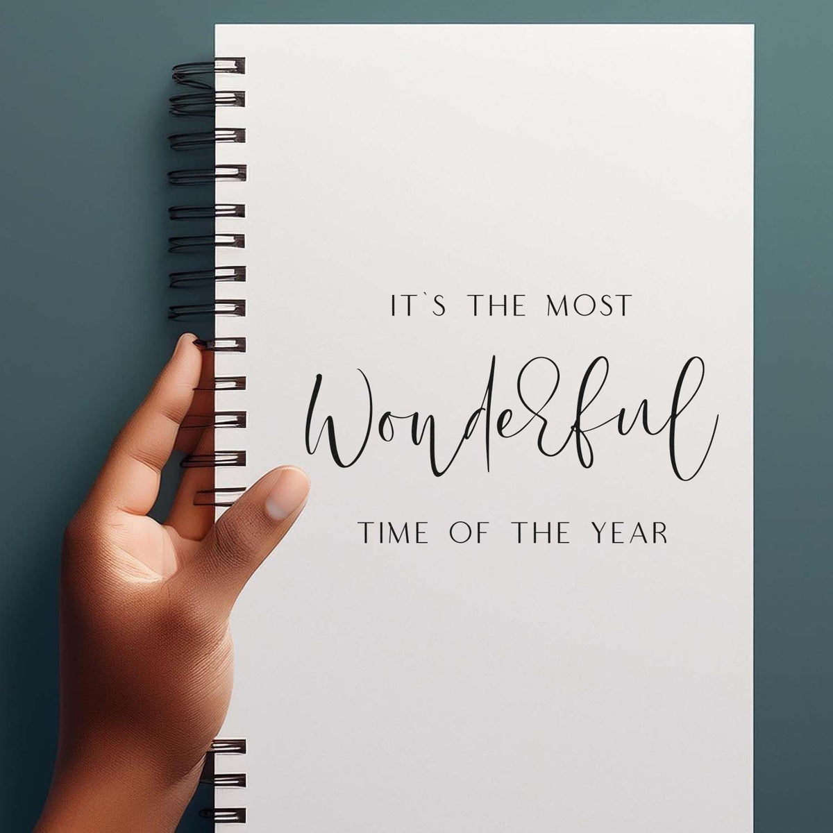 Custom stamp and seal notebook cover, white with black script quote, held by a hand on a teal background.