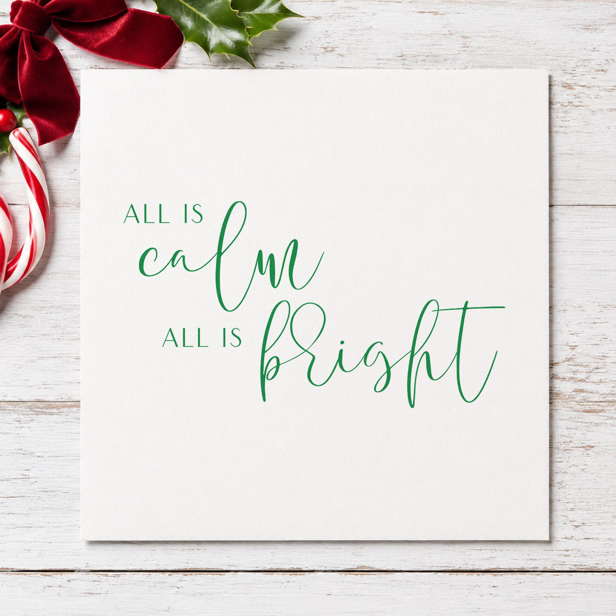 All Calm All Bright Lettering craft stamp imprint in green ink on a handmade project, one idea being menu course slips.