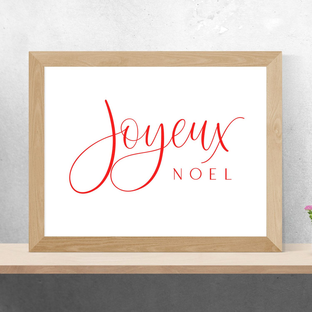 Joyeux Noel Fine Script rubber stamp shown in red ink, stamped for projects such as language album page.