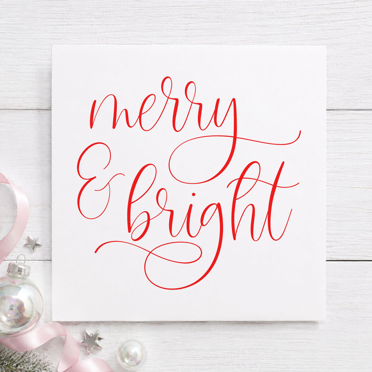 Merry And Bright Looped Script craft stamp in red ink on cardstock, an easy option for apron pocket printing.