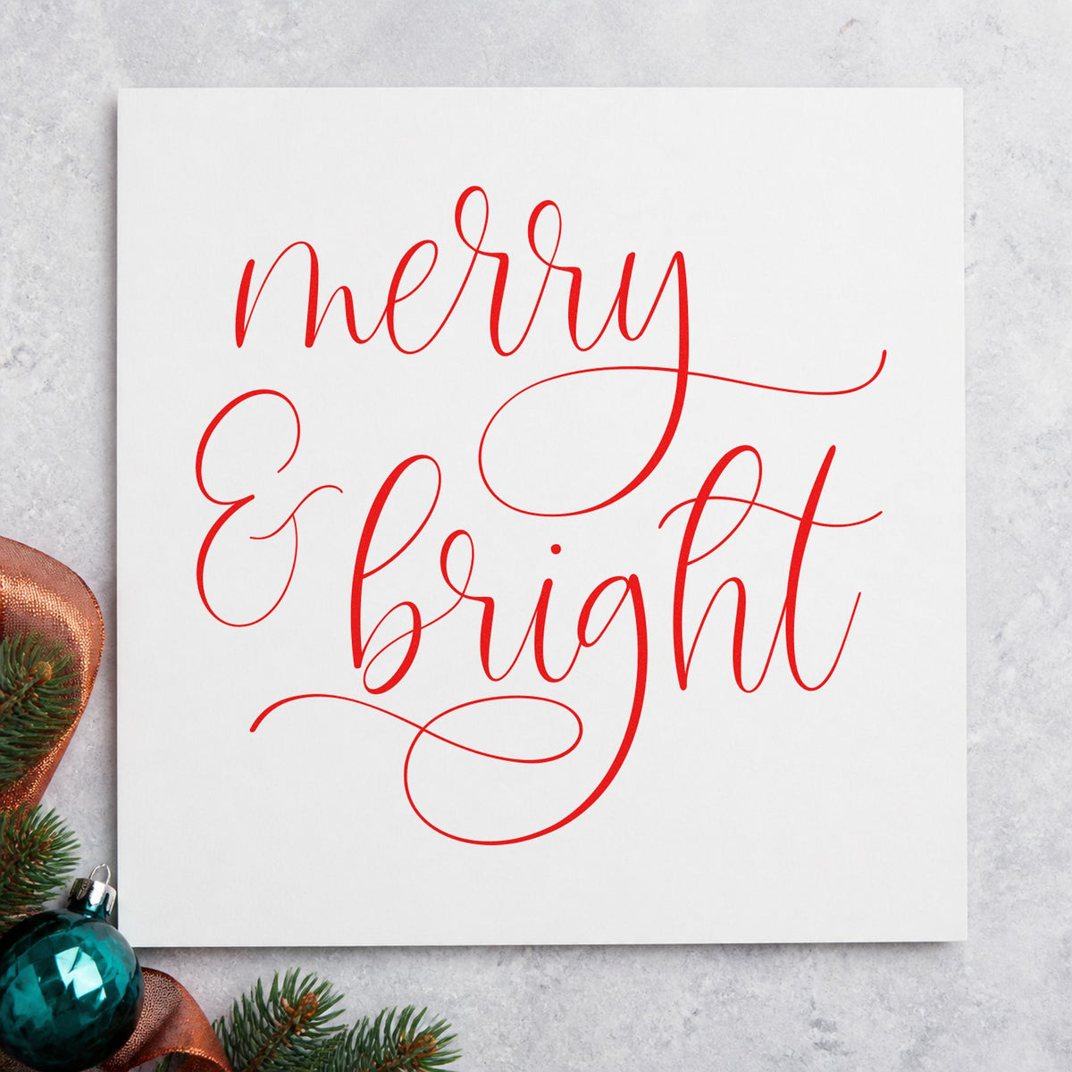 Merry And Bright Looped Script rubber stamp shown in red ink, stamped for projects such as nib tray labels.