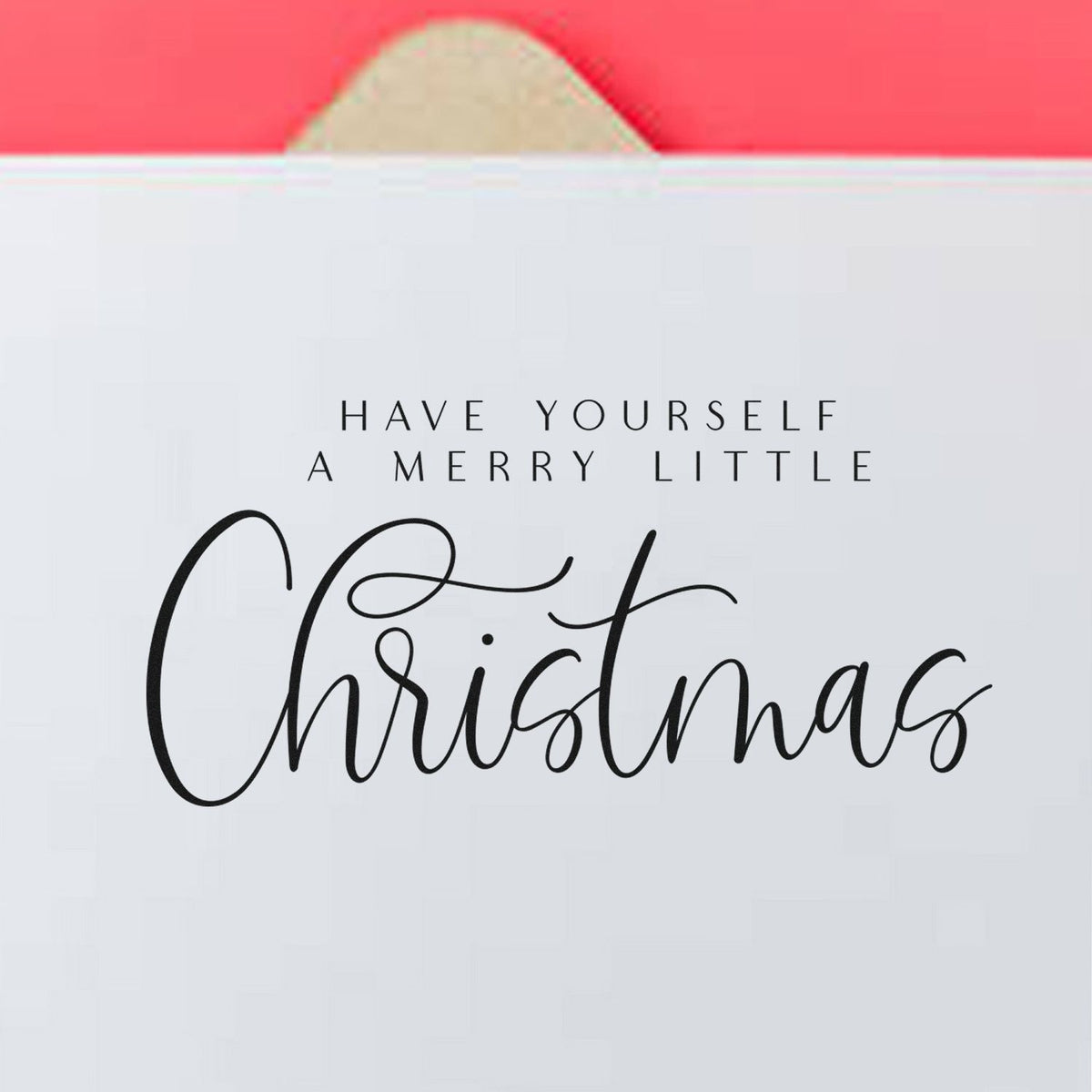 Christmas stamp and seal packaging on white with pink top, featuring black Have Yourself a Merry Little Christmas script.