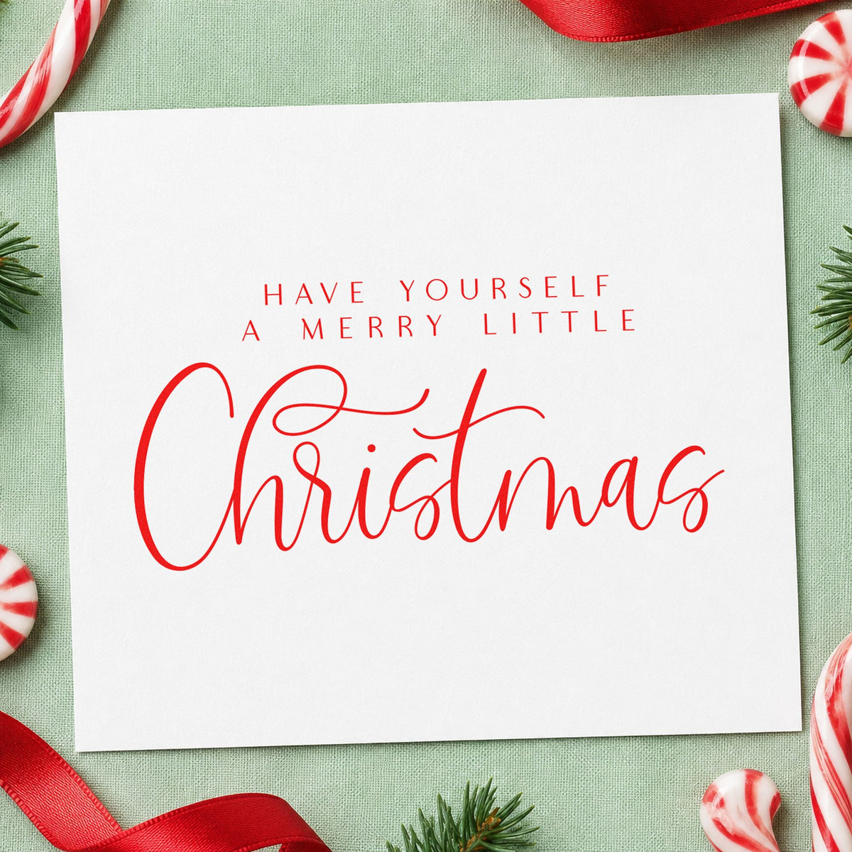 Merry Little Christmas Calligraphy craft stamp in red ink on cardstock, an easy option for chair back printing.