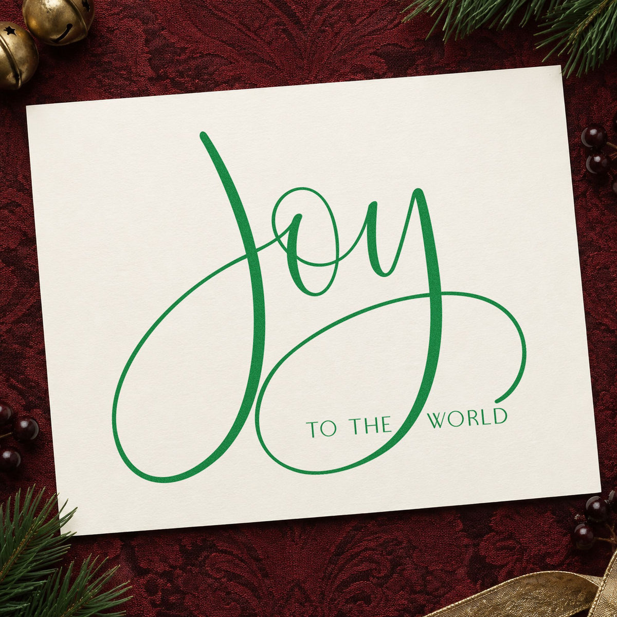 Joy To The World Loops craft stamp imprinted in green ink on paper, a design suited to framed shelf piece.