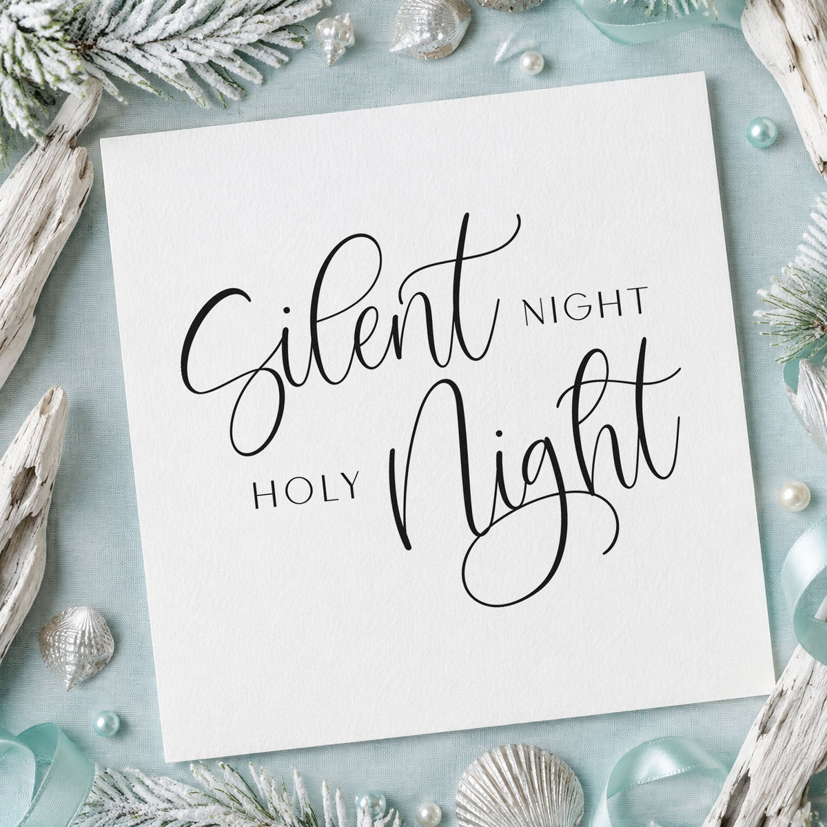 Silent Night Holy Night Calligraphy craft stamp imprint in black ink on a handmade project, one idea being paired line tags.