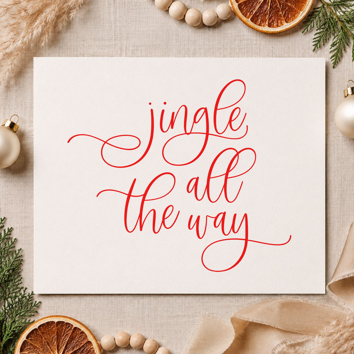 Jingle All The Way Loops craft stamp in red ink on cardstock, an easy option for sleeve drop printing.