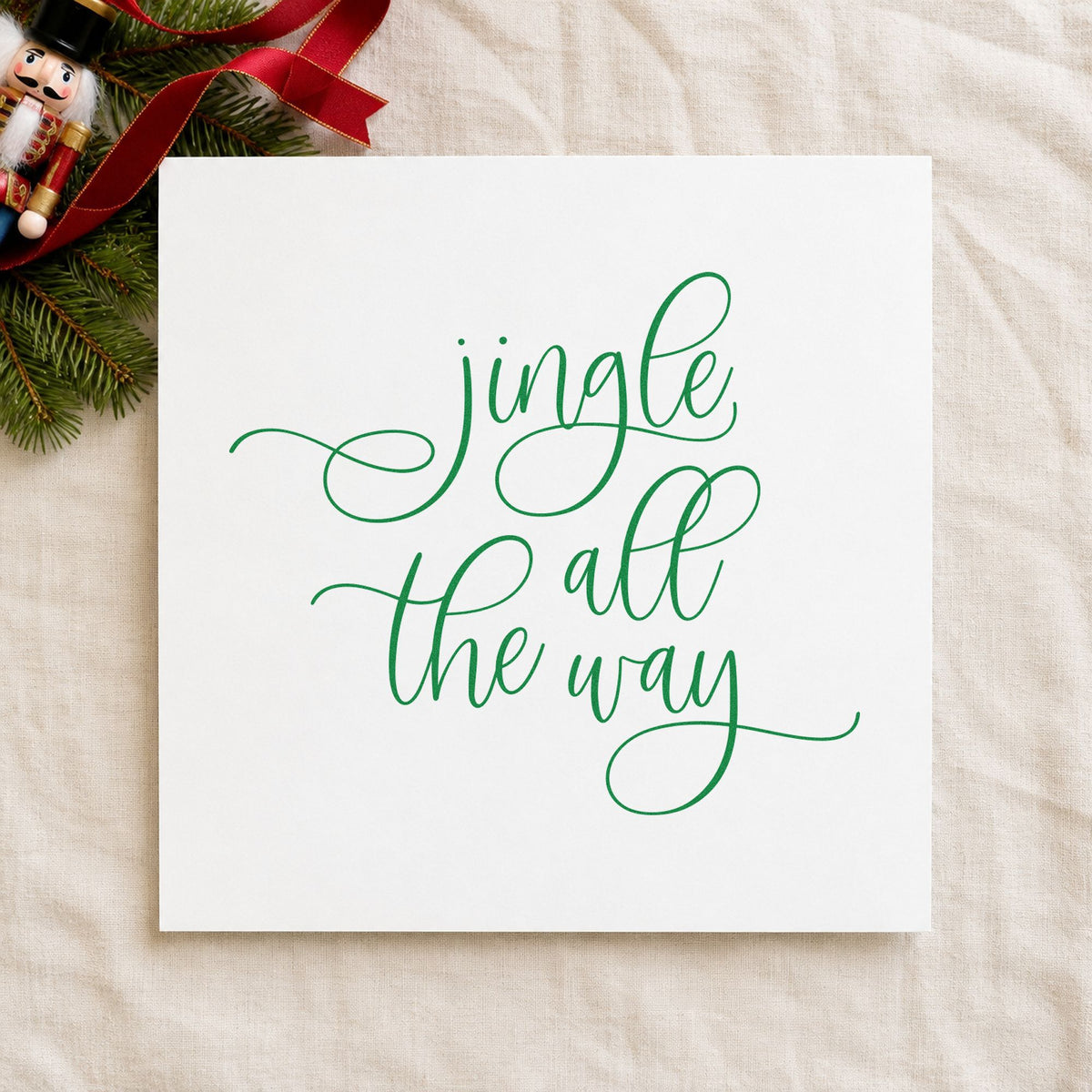 Jingle All The Way Loops craft stamp imprint in green ink on a handmade project, one idea being door frame slips.