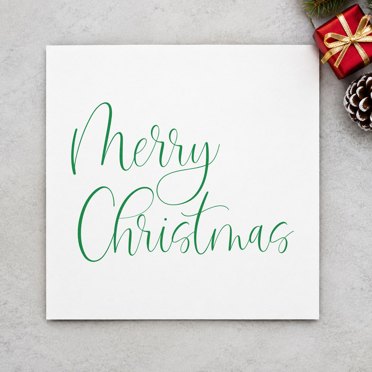 Merry Christmas Airy Calligraphy craft stamp imprinted in green ink on paper, a design suited to framed wide border.